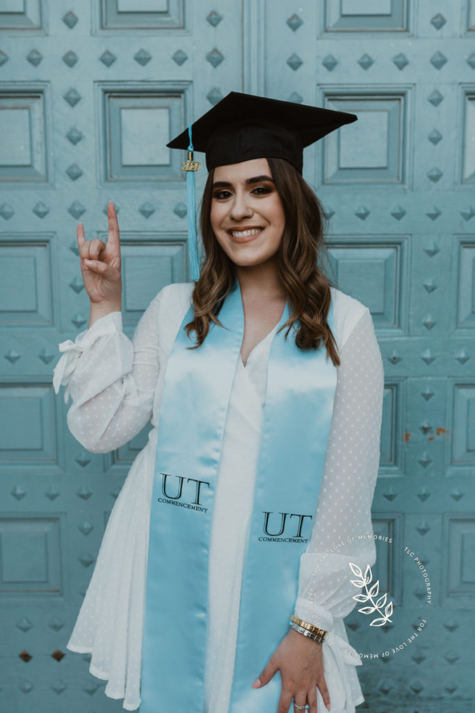 UT Austin senior photos in front of the Blue Door